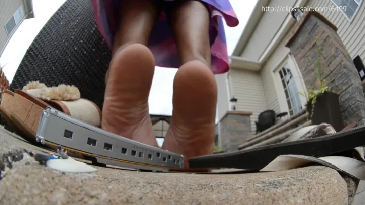 Gigantic Latina Tramples a Tiny Train Flat With Cork Wedges